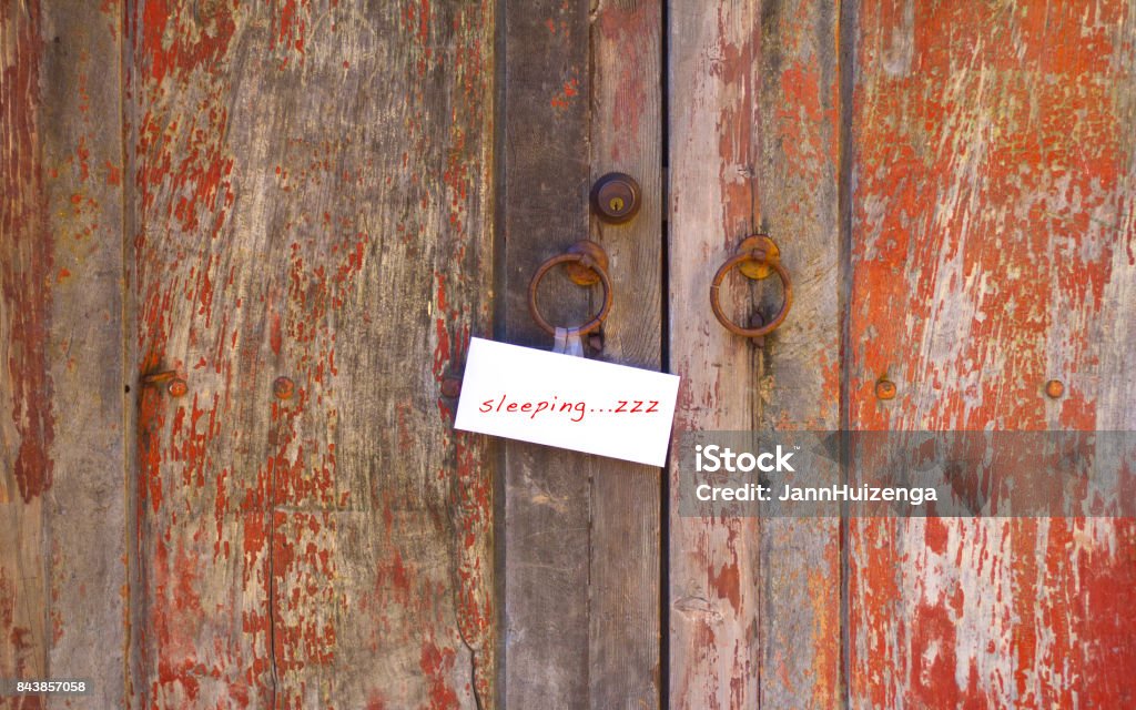 "Sleeping....ZZZ!" Note On Old Weathered Red Doors “Sleeping....ZZZ!" Note On Old Weathered Red Doors Sleeping Stock Photo