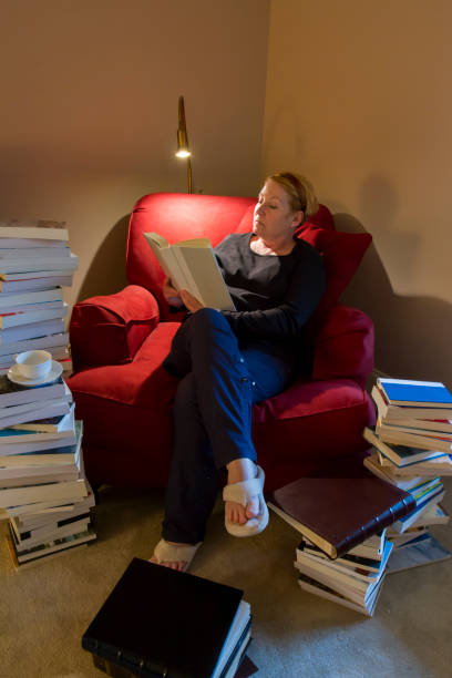 istock Woman in home reading 843857634