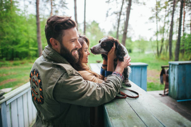 istock young couple with dog outside 843859930