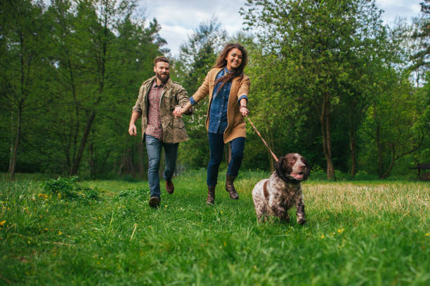 istock young couple with dog outside 843859934
