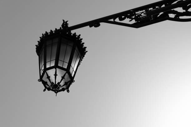 Ornate Iron Lamp Over Street