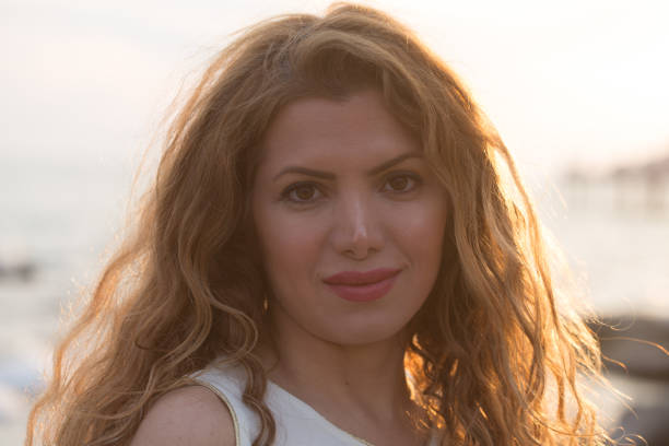 istock potrait of beautiful young woman with backlight 843867460