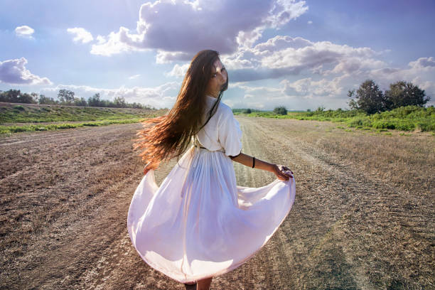 istock Gypsy woman on the dirty road dancing 843867486