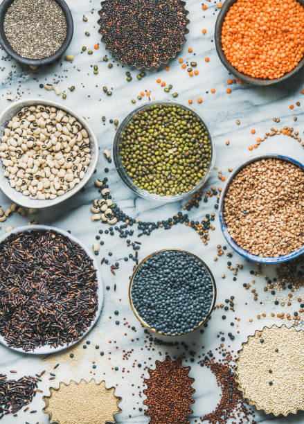 istock Various raw uncooked grains, beans, cereals in bowls, top view 843867636
