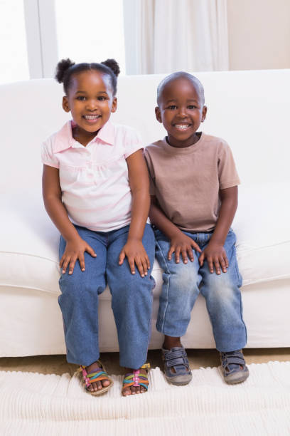 istock Happy siblings smiling at camera together 843870994