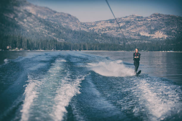 istock Beautiful woman waterskiing 843877972