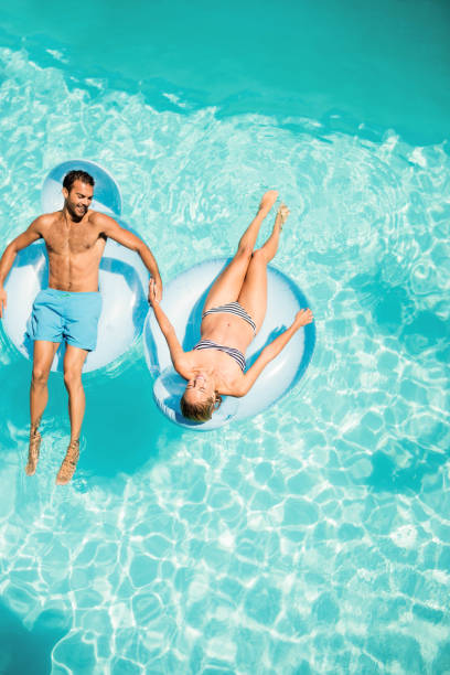 istock Happy couple on lilos 843878524