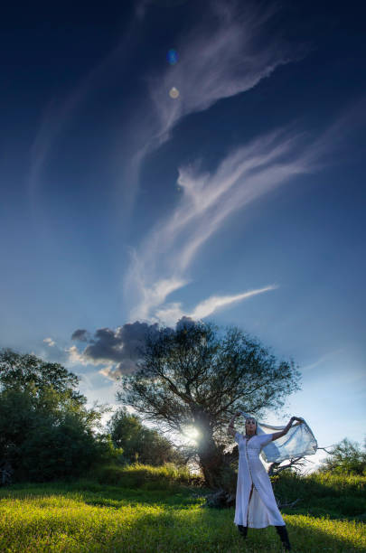 istock Woman in the white dress dancing 843884464
