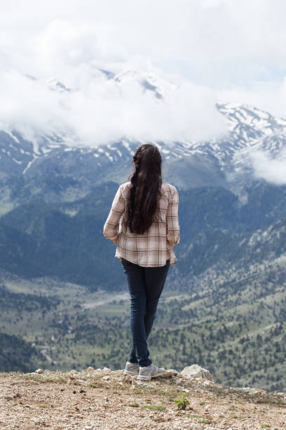 istock Woman traveller enjoying mountain view 843884940