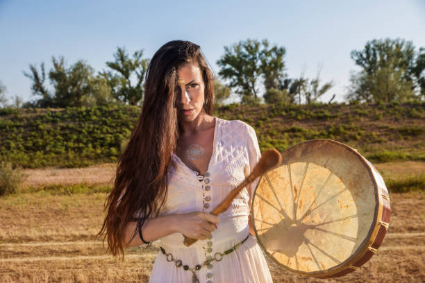 istock Shaman woman  drumming  closer 843887768