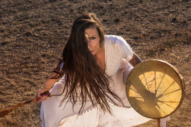 istock Shaman woman drumming 843887780