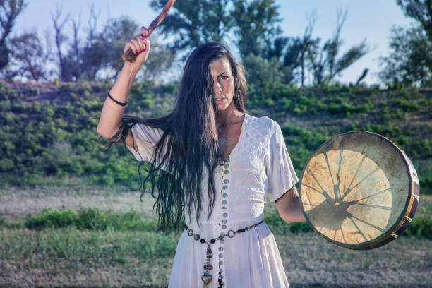 istock Shaman woman drumming closeup 843889572