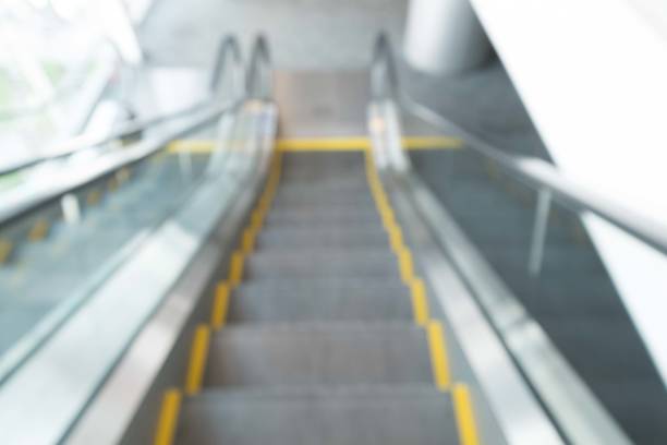 istock Blur modern steps of moving business escalator 843889606