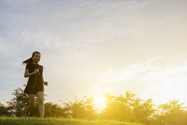 istock Runner woman running in the garden 843906374