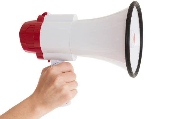 istock Close up of hand holding bullhorn 843906690