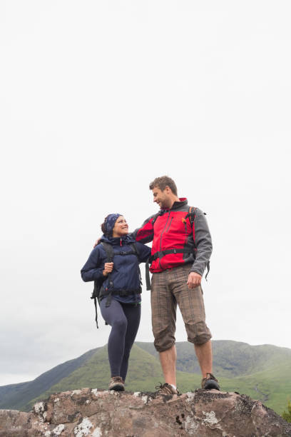 istock Couple standing on a rock embracing 843906860