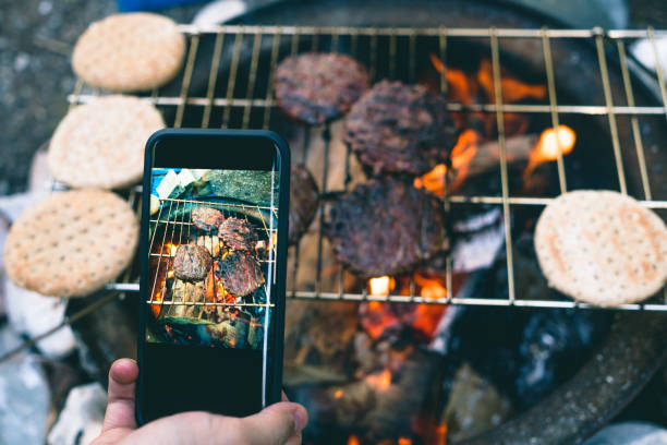 istock Cellphone taking photo of camp cooking 843907002