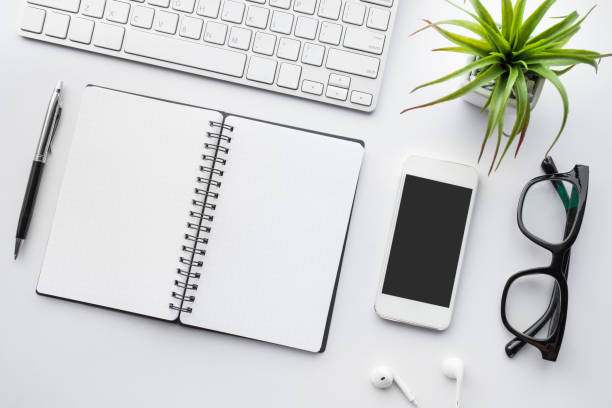 istock Business table top with mock up office supplies on white 843913758