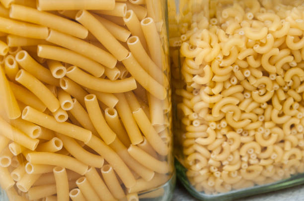 closeup of pasta in glass jars