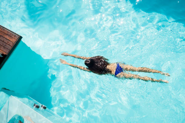 istock Fit woman swimming in the pool 843924590