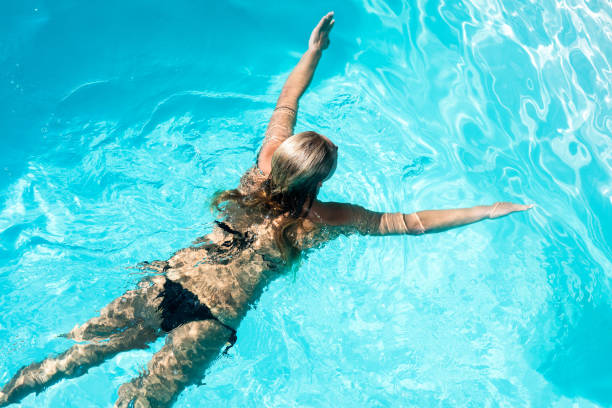 istock Fit woman swimming in the pool 843925120