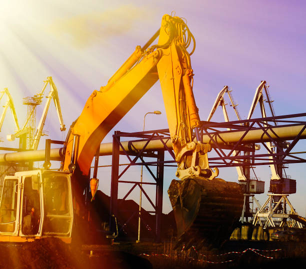 istock excavator against blue sunny sky 843932588