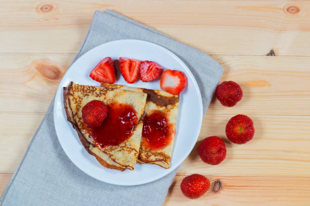 istock Crepes with fresh strawberries and jam 843932820
