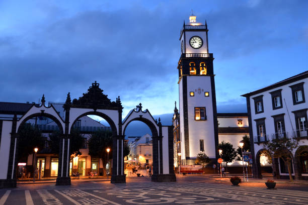 Old city of Ponta Delgada by night Ponta Delgada by night with the old city, the church San Sebastiao, the city gate and the place of the republic sao miguel azores stock pictures, royalty-free photos & images