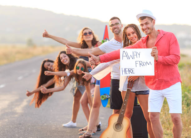istock Group of friends hitchhiking 843935226