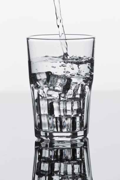 istock pouring water on a glass 843936364