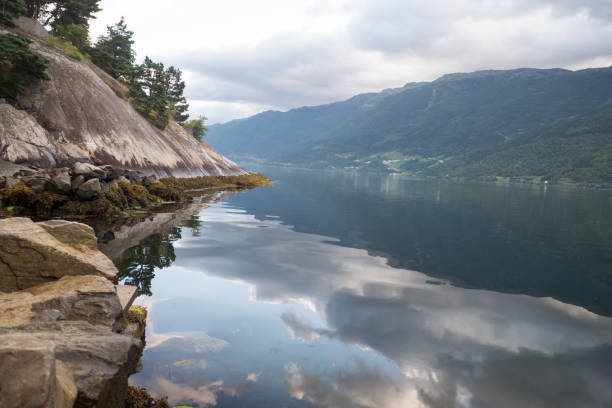 istock Norway - ideal fjord reflection in clear water 843941350