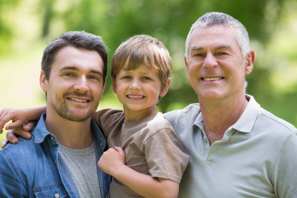 istock Grandfather father and son smiling at park 843942260