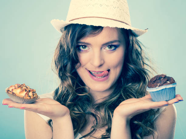 istock Smiling summer woman holds cakes in hand 843945686