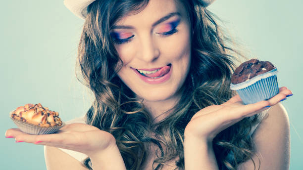 istock Smiling summer woman holds cakes in hand 843946712