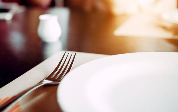 istock Alone fork near dish on desk in restaurant. 843949444