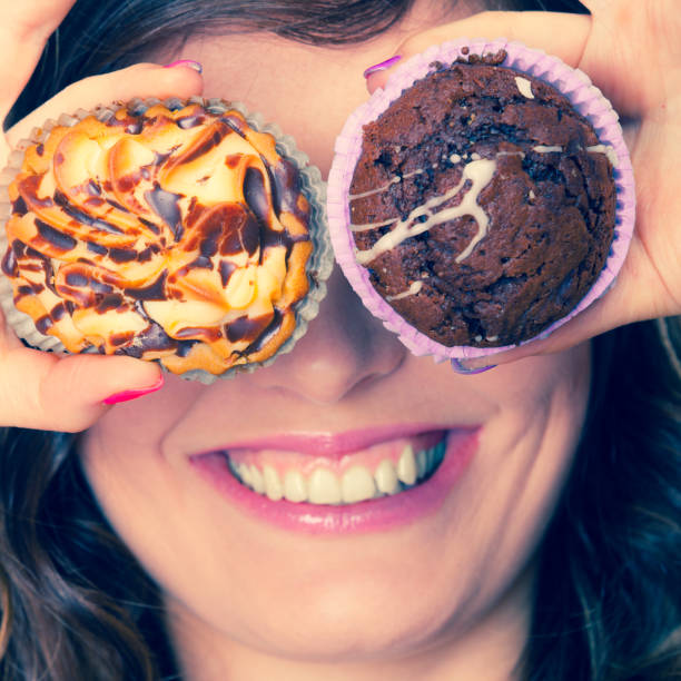 istock Smiling crazy woman holds cakes in hand 843950226