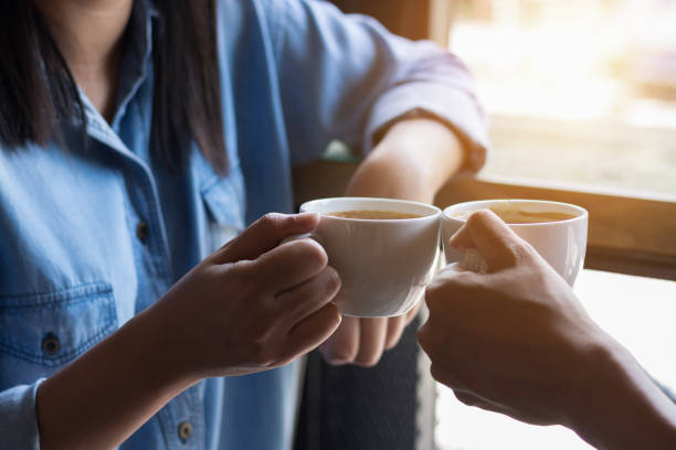 istock Two attractive women in coffee shop 843951126