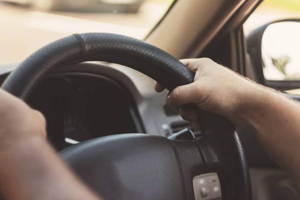 istock man's hands on the steering wheel retro toning car 843951664