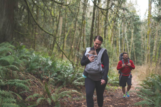 istock Parents hiking with young children in the forest 843952152