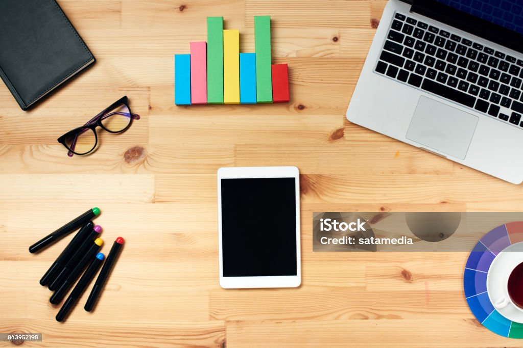 Designer desk with equipment Creative financial specialist desk top view Accountancy Stock Photo