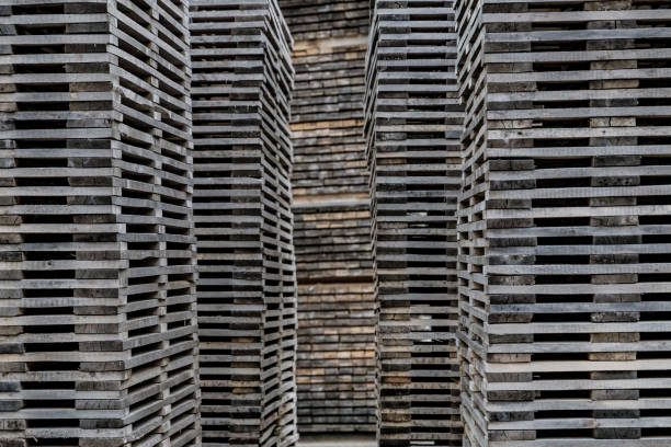 istock Decayed piles of wooden planks stacked 843955206