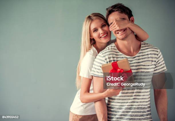 Romantic Young Couple Stock Photo - Download Image Now - Gift, Surprise, Valentine's Day - Holiday