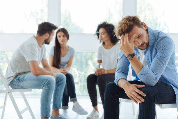 istock Sad depressed man holding his head 843961260