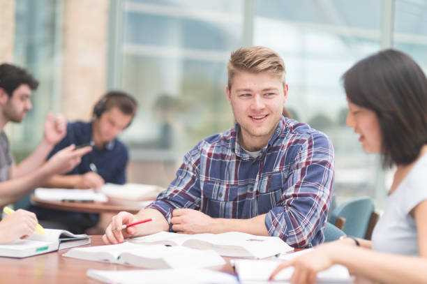 istock Multi-ethnic group of college students studying in conference room 843963020