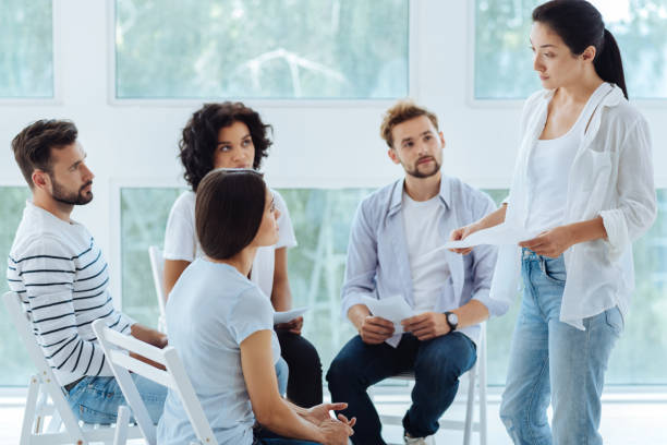 istock Professional serious therapist looking at her patient 843966000