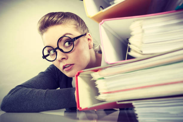 istock Accountant terrified of pils of binders. 843966048