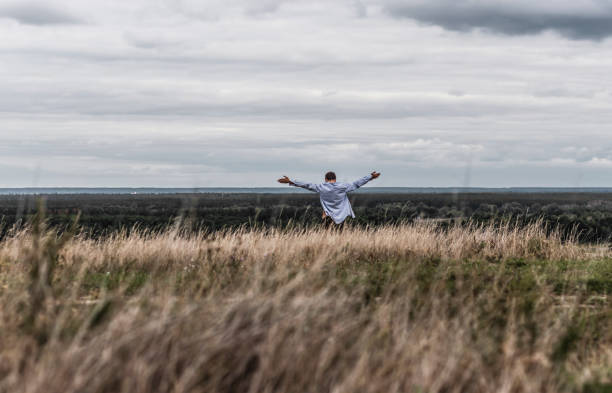 istock Man who feels free, looking at the horizon 843966074