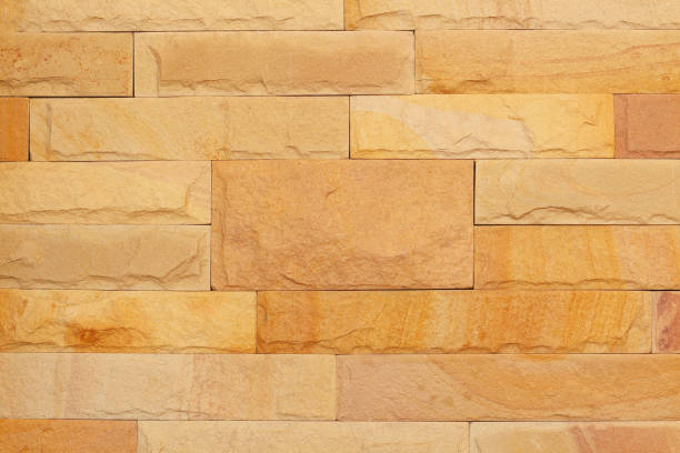 istock Background of modern stone brick wall texture, abstract sand wall or granite wall in natural patterns for design art work. 843966092