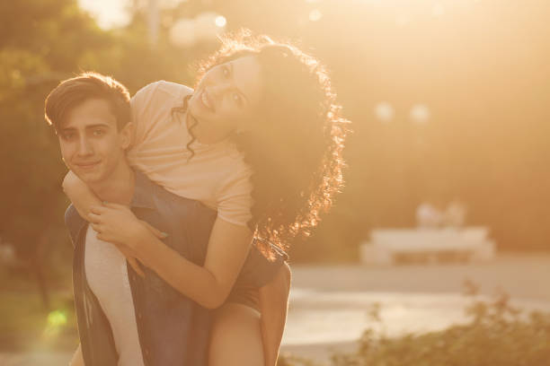 istock Teenagers in park at sunset 843969208