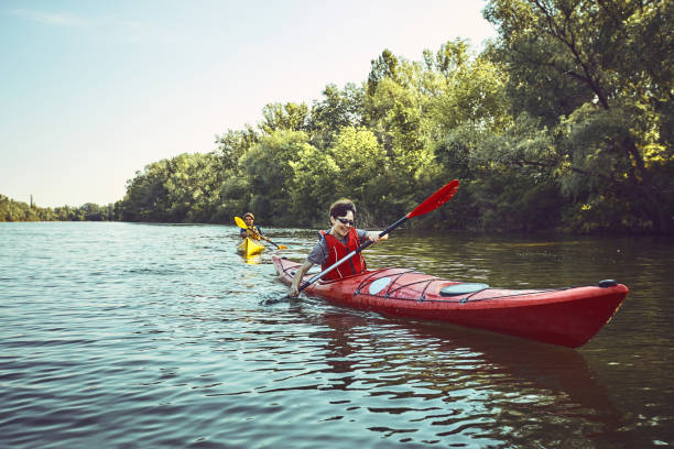 istock A canoe trip along the river along the forest in summer. 843969364